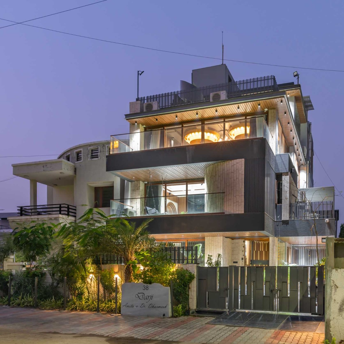 Dusk light exterior view of Dr. Dharmesh Darji Villa by Vihar Fadia Architects