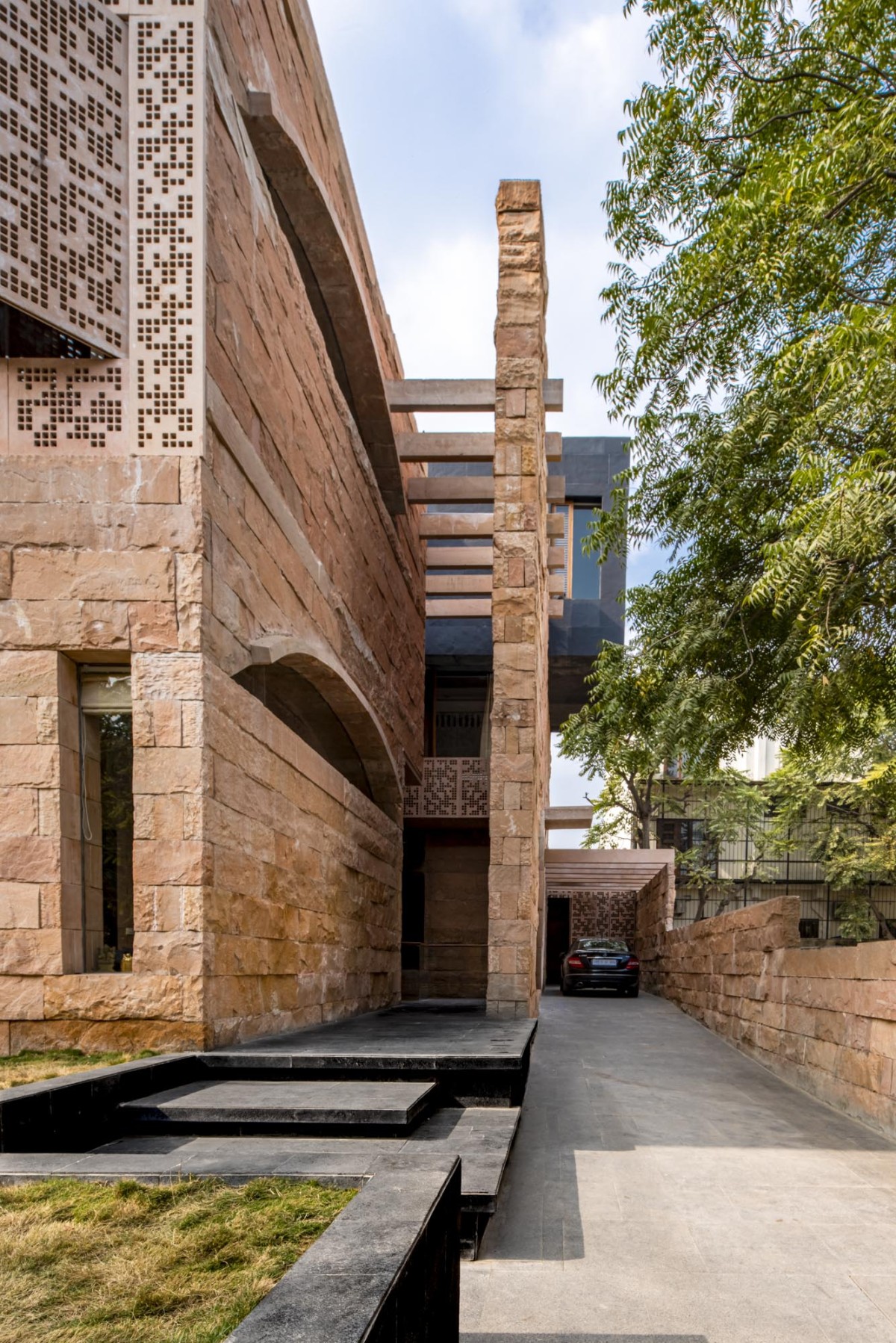 Driveway of Stone House by Malik Architecture