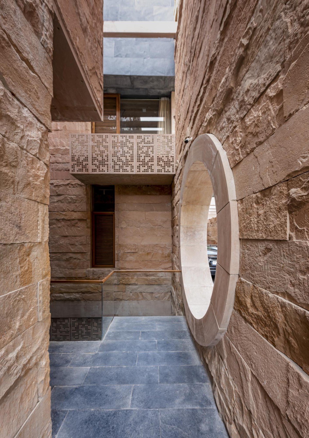 Entrance passage of Stone House by Malik Architecture