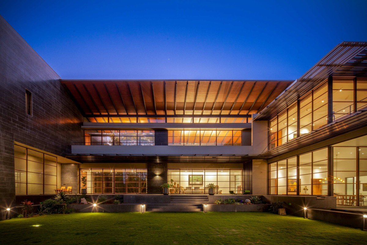 Dusk light exterior view of Black Bastion House by SPASM Design Architects