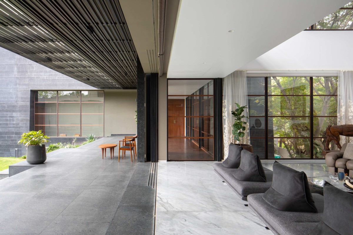 Deck and Living room of Black Bastion House by SPASM Design Architects