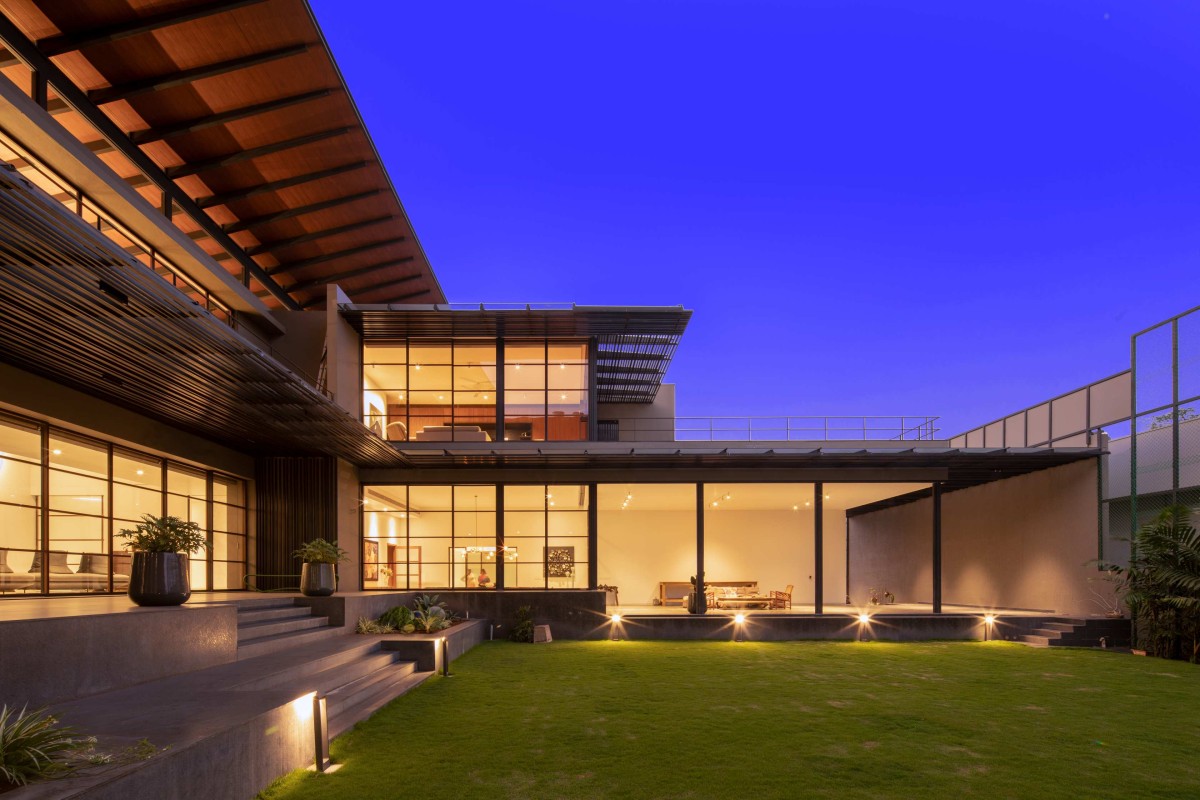 Dusk light exterior view of Black Bastion House by SPASM Design Architects