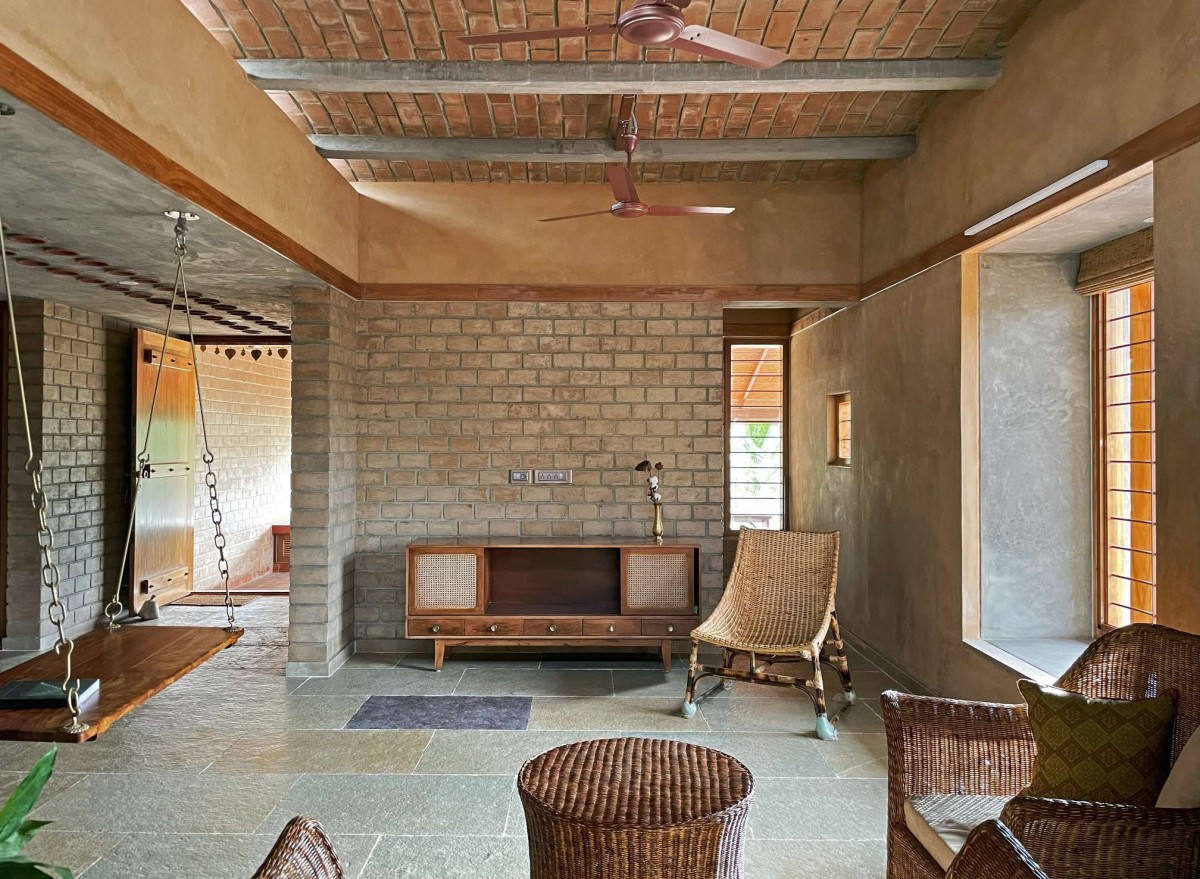 Living room carrying the jack arch roof of Makizham Thottam by Second Ground