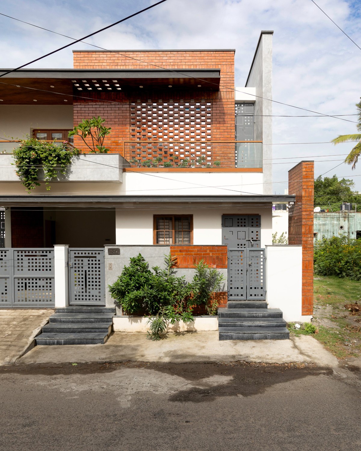 Exterior view of Perforated Plane House by D.L.E.A