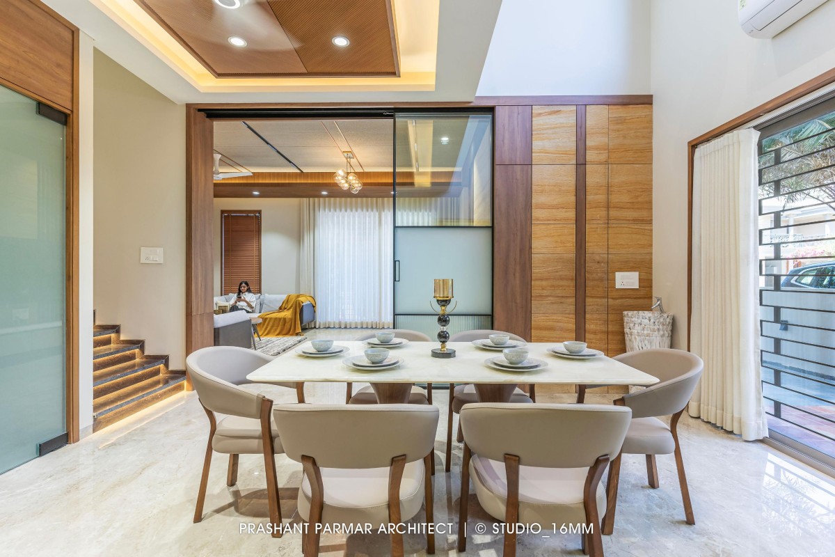 Dining of 4 BHK Timeless Elegance at Saamarth City by Prashant Parmar Architect