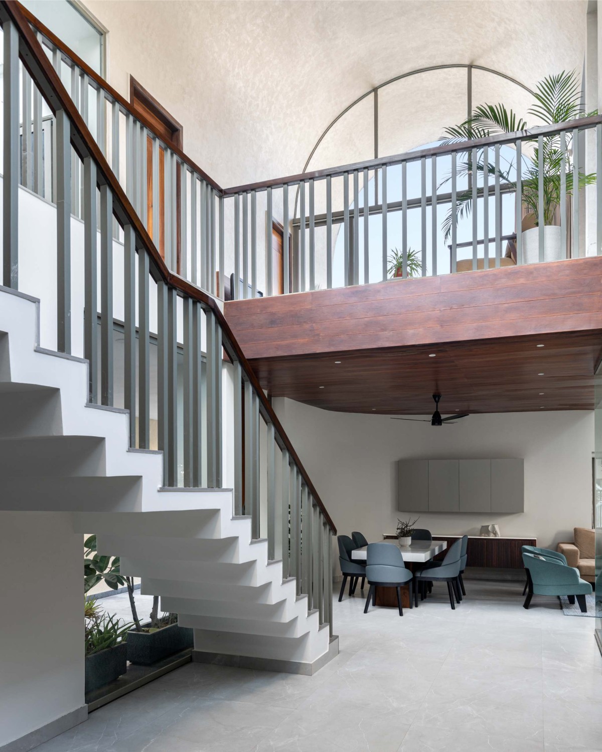 Passage to staircase and dining of Vault House by Sifti Design Studio