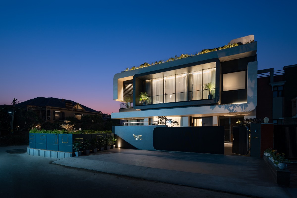 Dusk light exterior view of Residence 100 by Subash and Associates