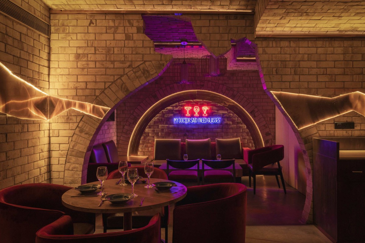 The private lounges at the rear end of the bar is enclosed in an broken arched entrance