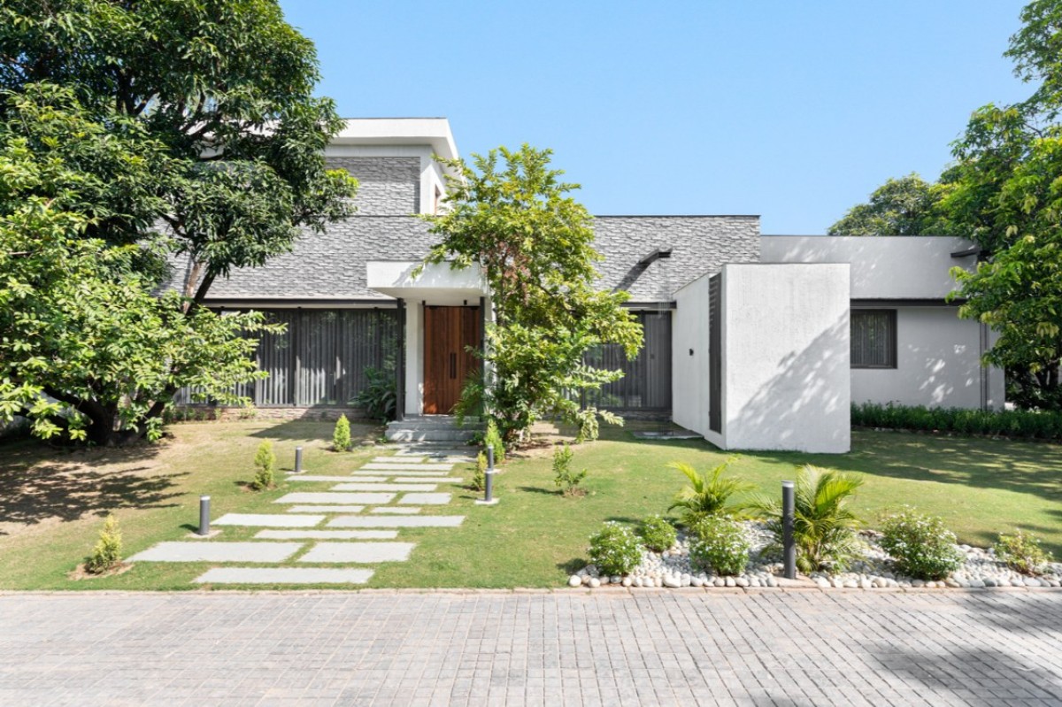 Front Porch of House of Mango Shadows by Design i.O Architects