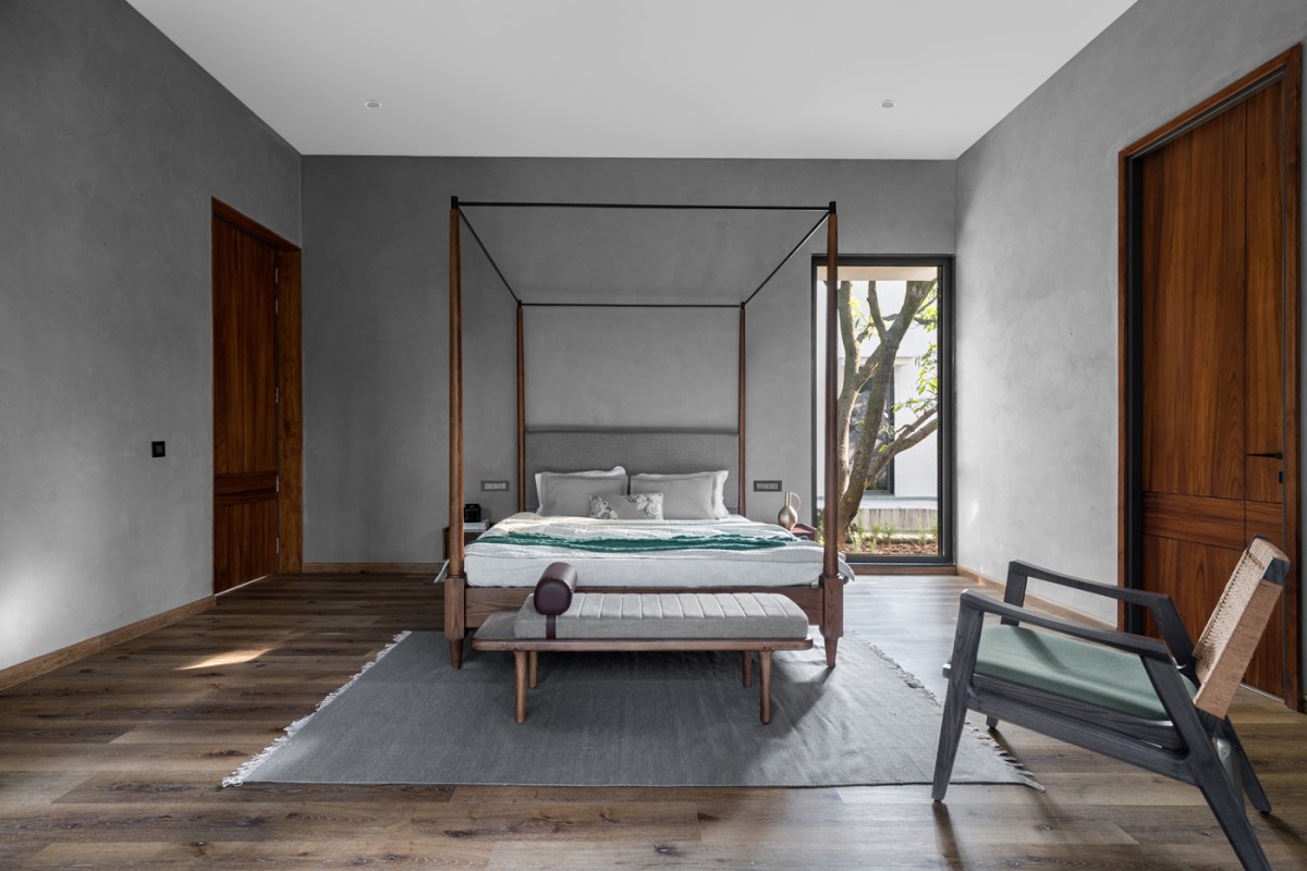 Bedroom 2 of House of Mango Shadows by Design i.O Architects