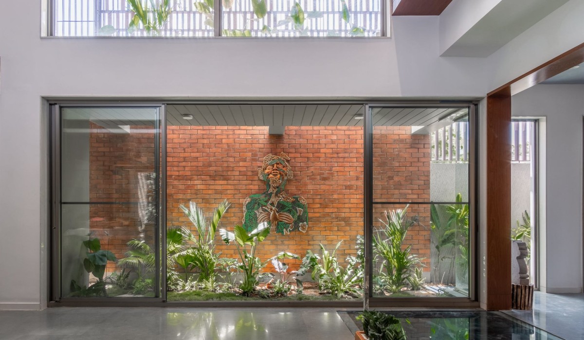 Court view from living room of One Ground Home by Shanmugam Associates