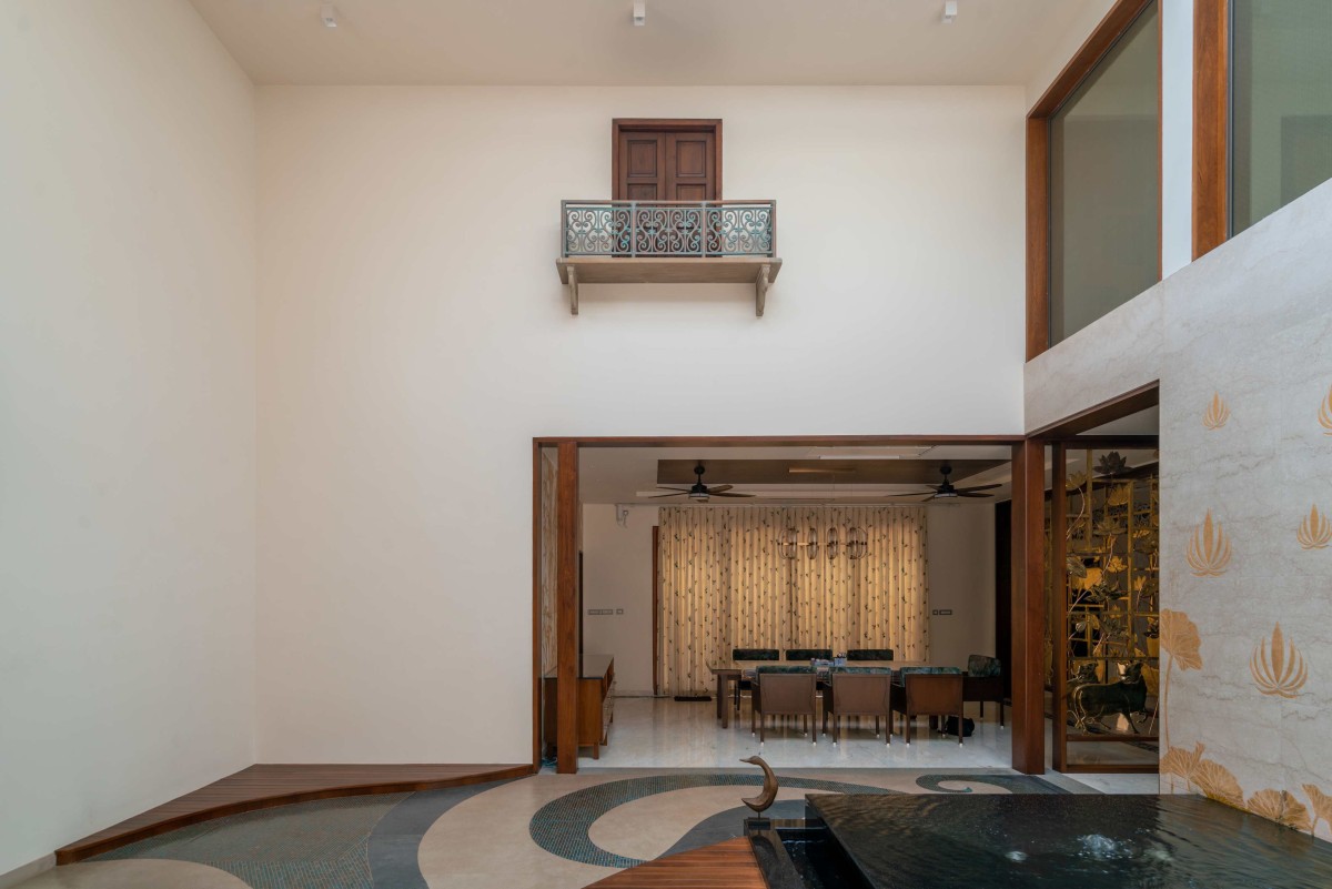 Double Height Court to Dining room view of The Yarn House by Vishwakarma Design Studio