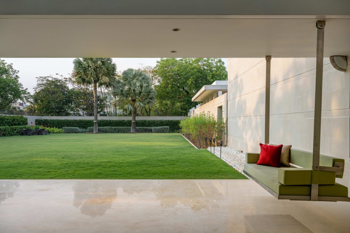 Sitout & Lawn of Lakhani Villa by INI Design Studio