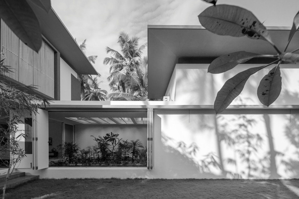 Exterior view of The Floating Parasol House by LIJO.RENY.architects