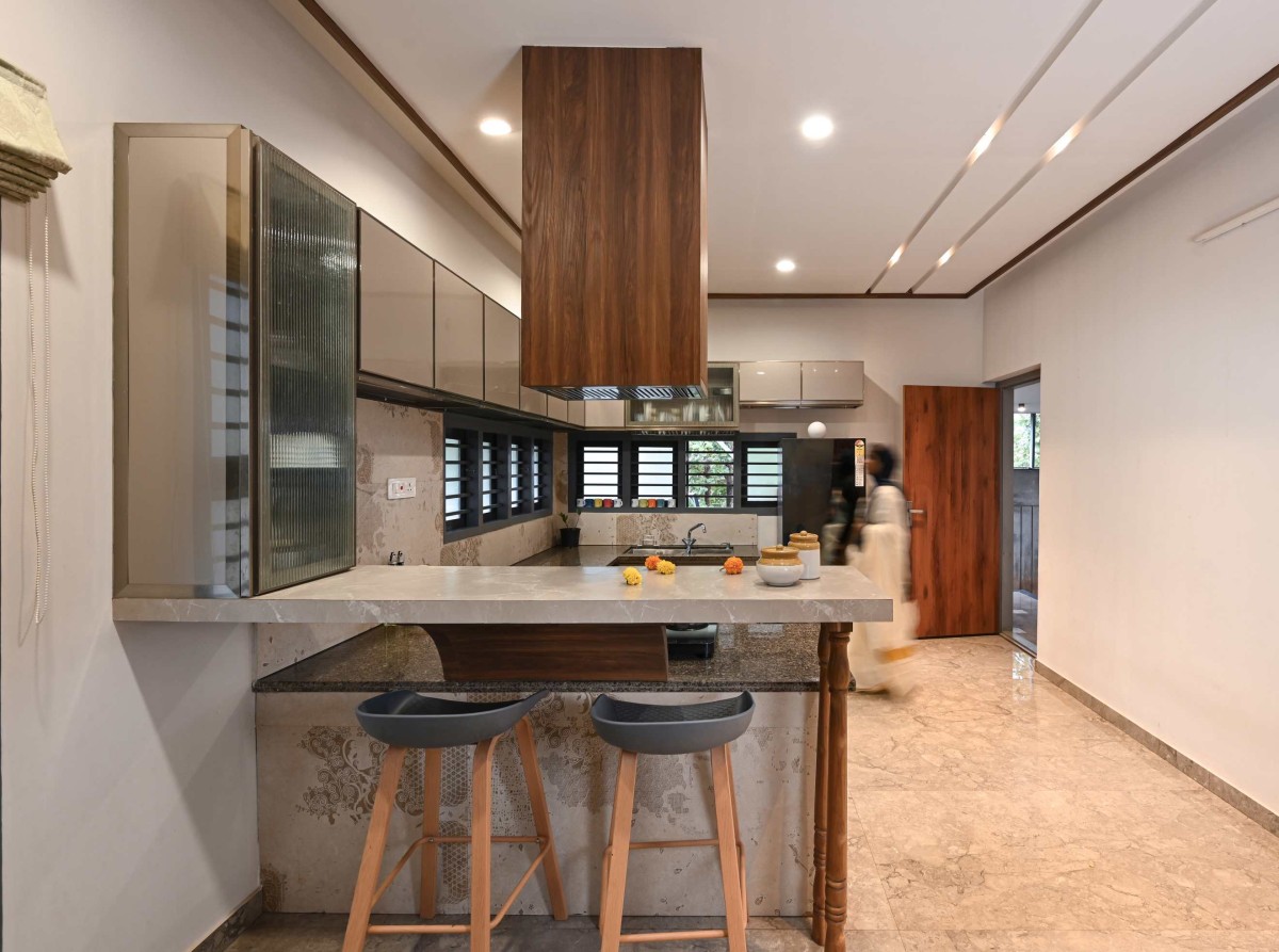 Kitchen of Phancy Laat by Melethil Architects