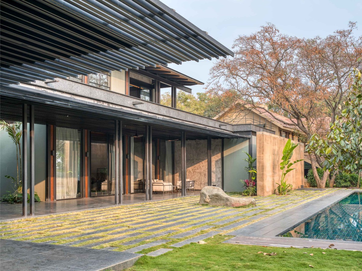 Pool side view of Lake Shore House by SPASM Design Architects