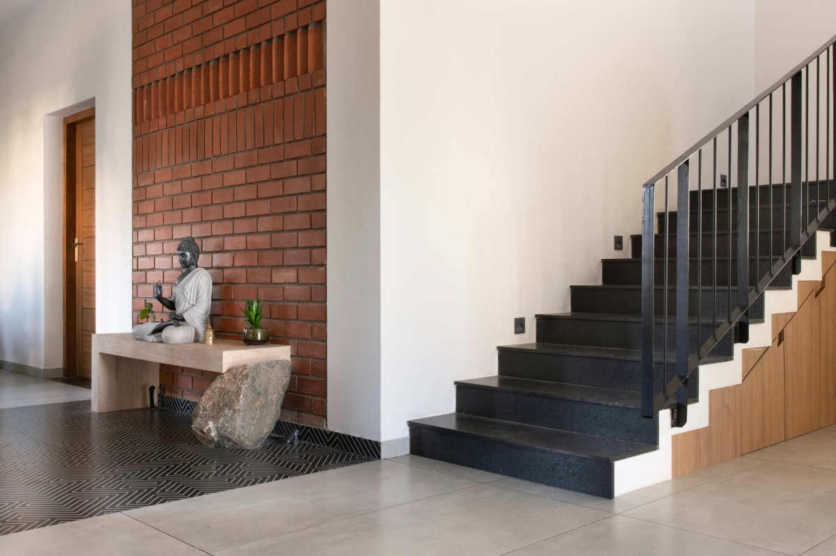 Staircase View With Exposed Brick of Neem House by Hashone Design Studio