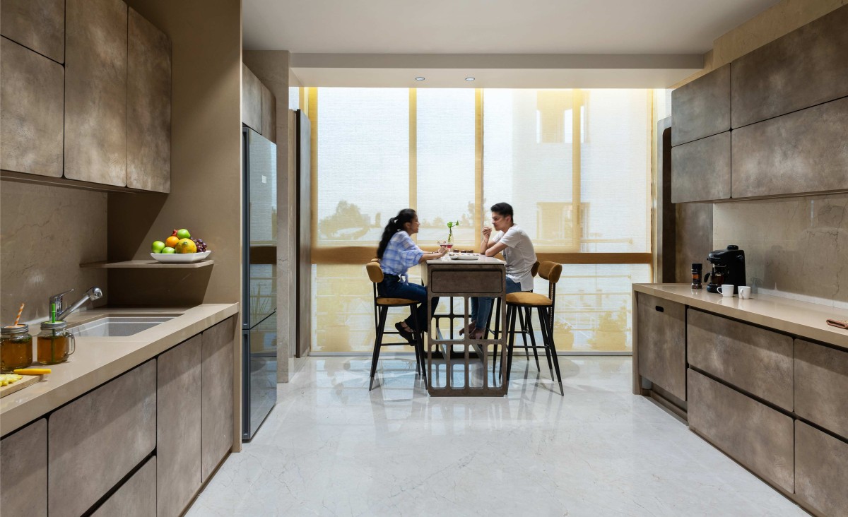 View from kitchen of Round Edged House by Sanjay Newaskar Designs LLP