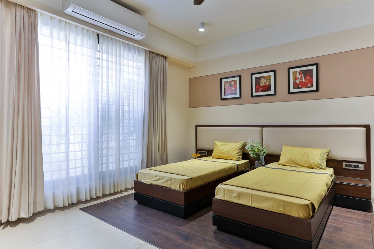 Guest Bedroom of Twin Gable House by RKGA Consultants Pvt Ltd