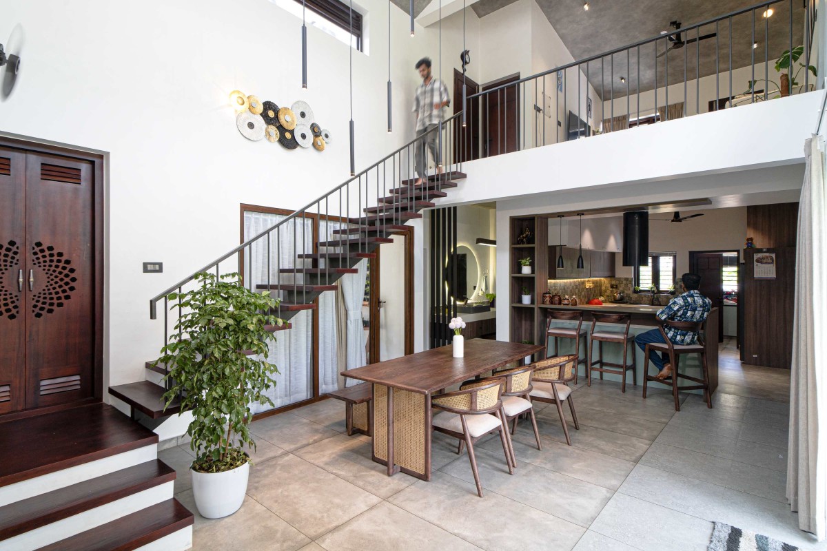 Dining to Kitchen view of Ikebana Residence by Mayaa Studio