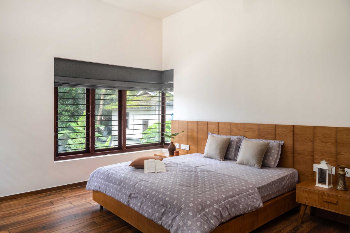 Bedroom of House Beneath a Jackfruit Tree by Uru Consulting LLP