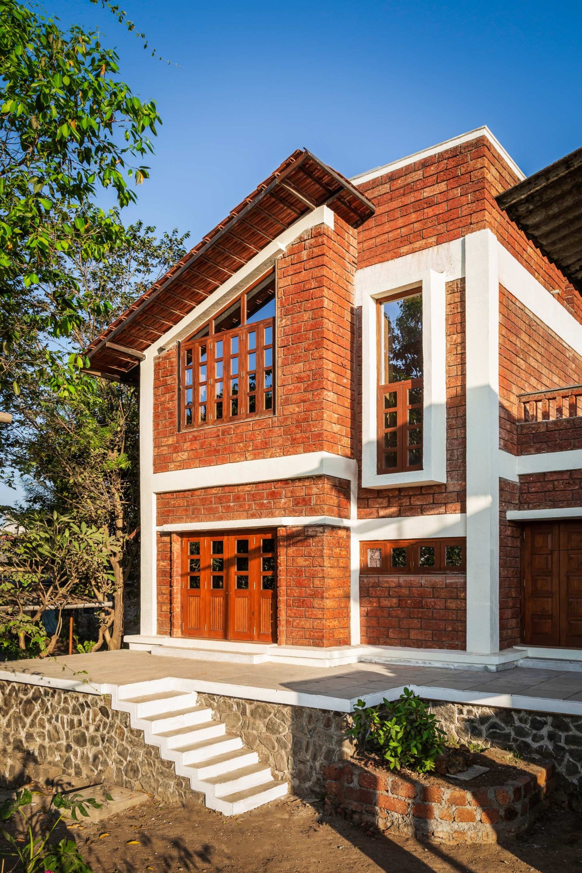 Exterior view of Suryangan - The Courtyard House by Suyash Mankame Design Studio