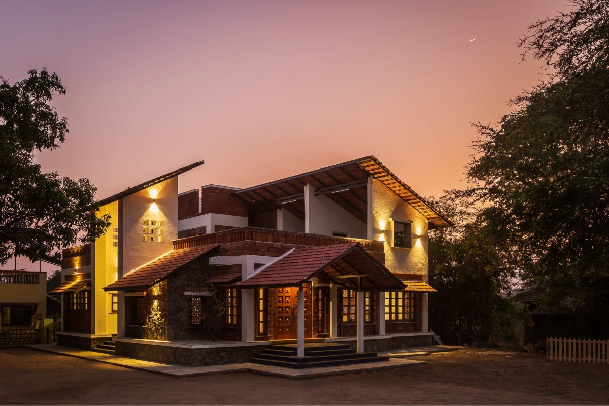 Dusk light exterior view of Suryangan - The Courtyard House by Suyash Mankame Design Studio