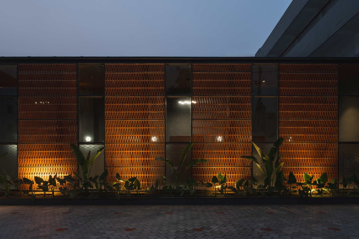 Dusk light exterior view of JKC Auditorium by Dimensions
