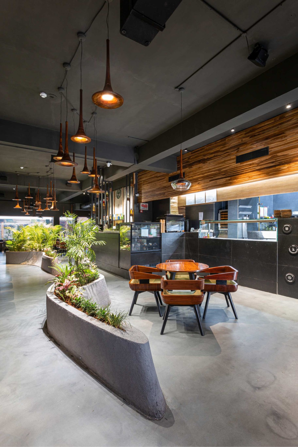 Dining to serving counter view of Aja by Arch.Lab