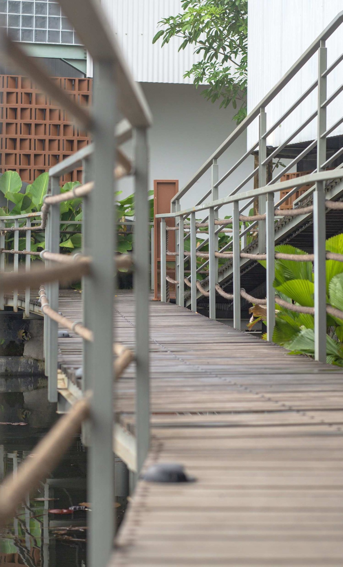 Detailed shot of Pedestrian wooden deck of PADI Rest Area by MIV Architects