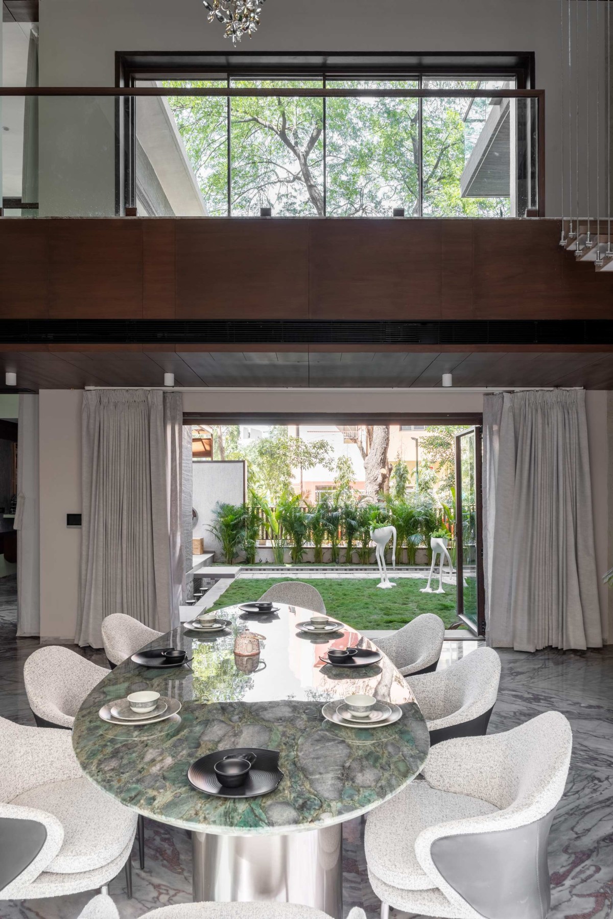 Dining of Green Serene House by Manoj Patel Design Studio