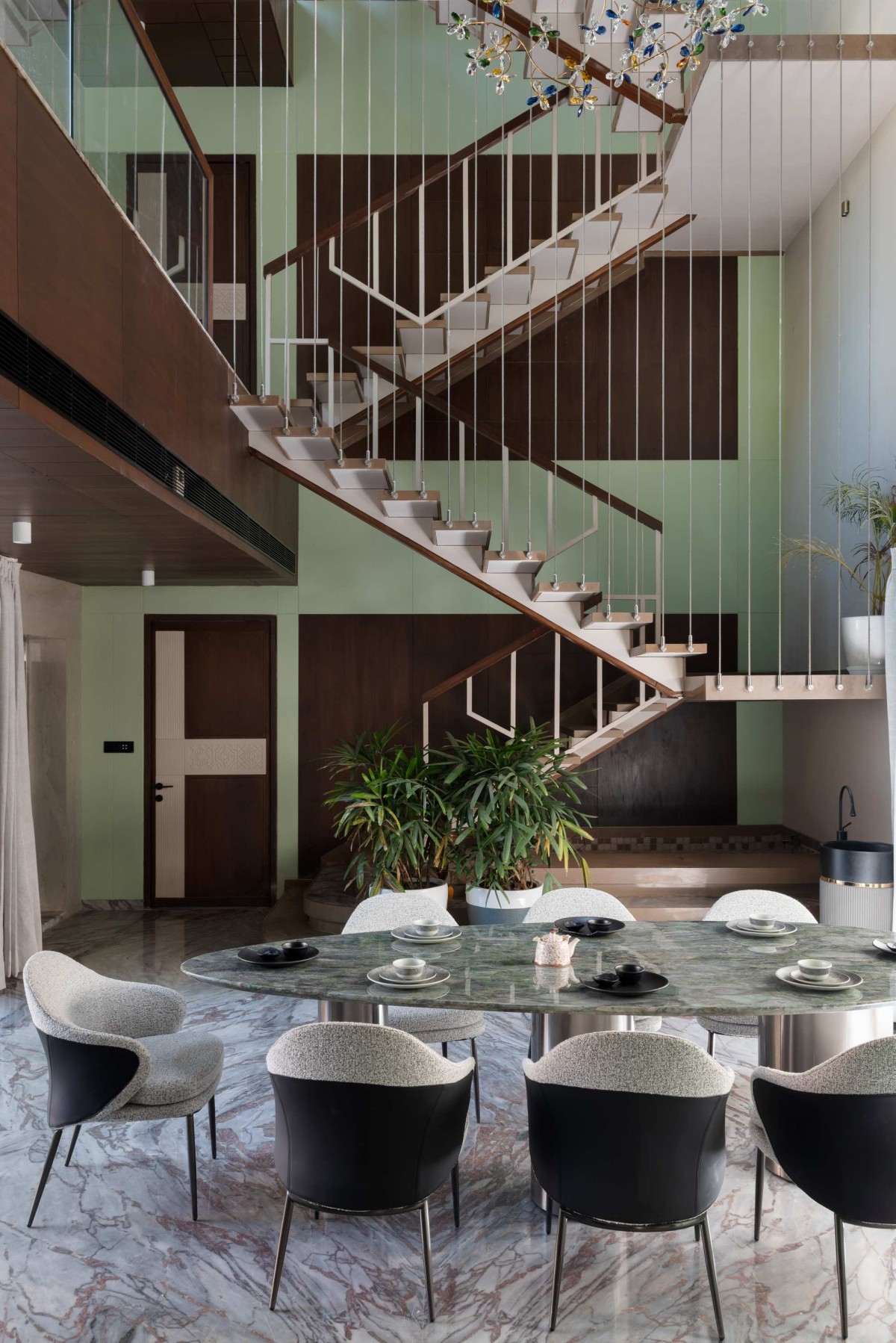 Dining of Green Serene House by Manoj Patel Design Studio
