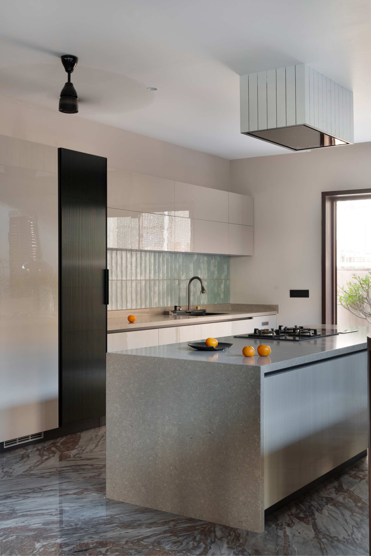 Kitchen of Green Serene House by Manoj Patel Design Studio