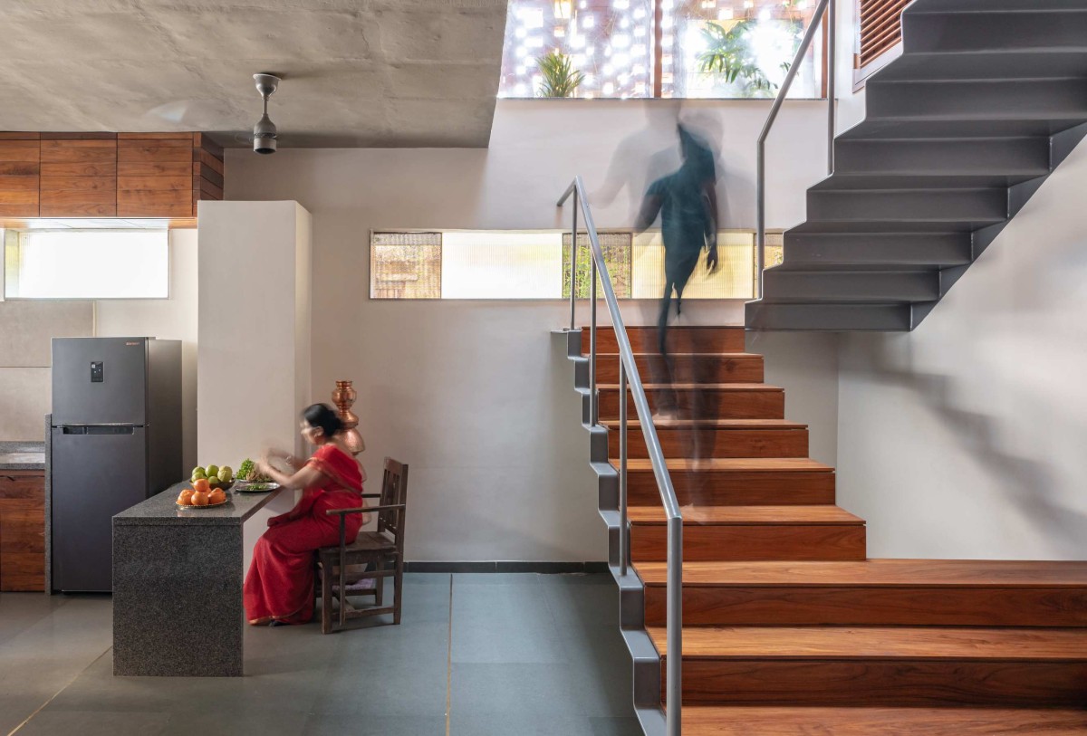 Kitchen to Staircase View of A Dialogue with the Past House by A Threshold