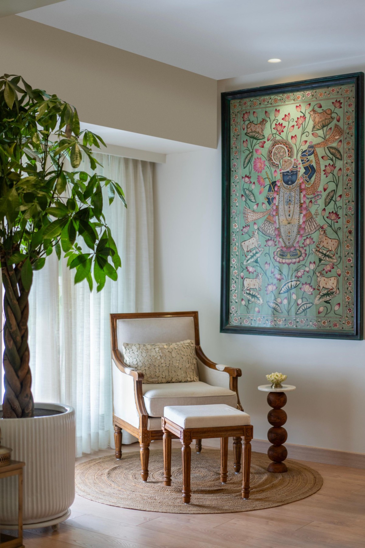 A ready nook under the beautiful pichwai and pachira plant of Maison Blanche by Oris Architects