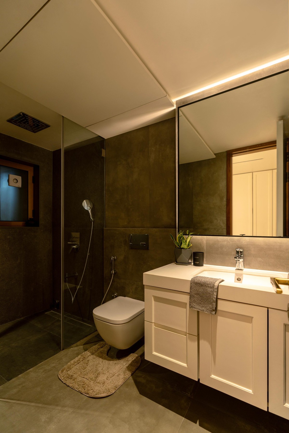 Concrete finish bathroom with steam and shower of Maison Blanche by Oris Architects