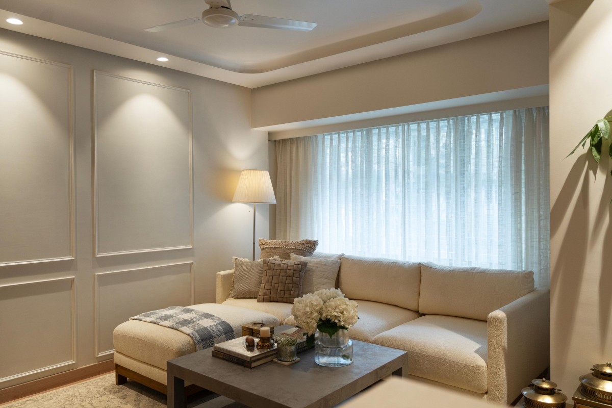 Custom P.O.P finish spot lights draw shadow on the wall panelling of Maison Blanche by Oris Architects
