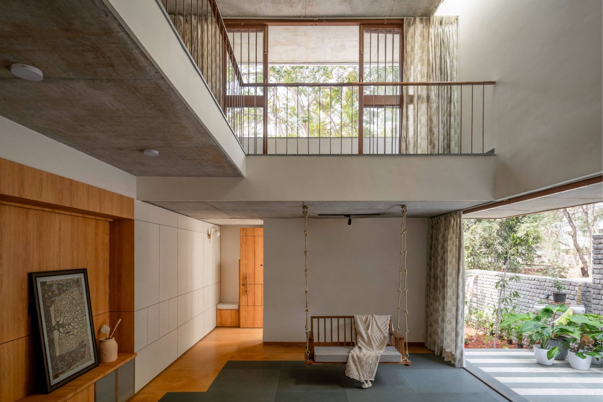 Living space flows into a verandah of The Enfold by Studio Biosis