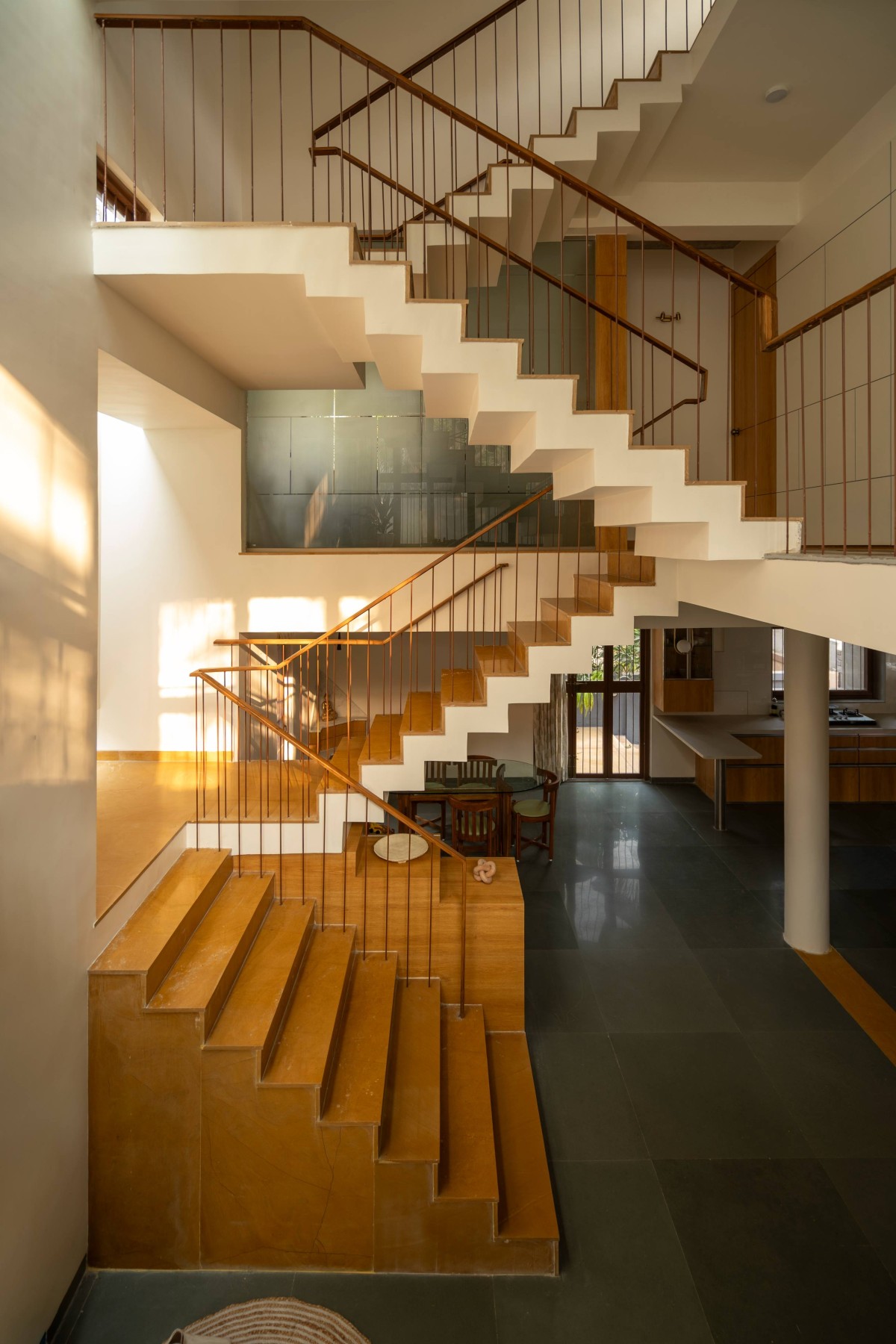 Staircase with a distinct sectional shift of The Enfold by Studio Biosis