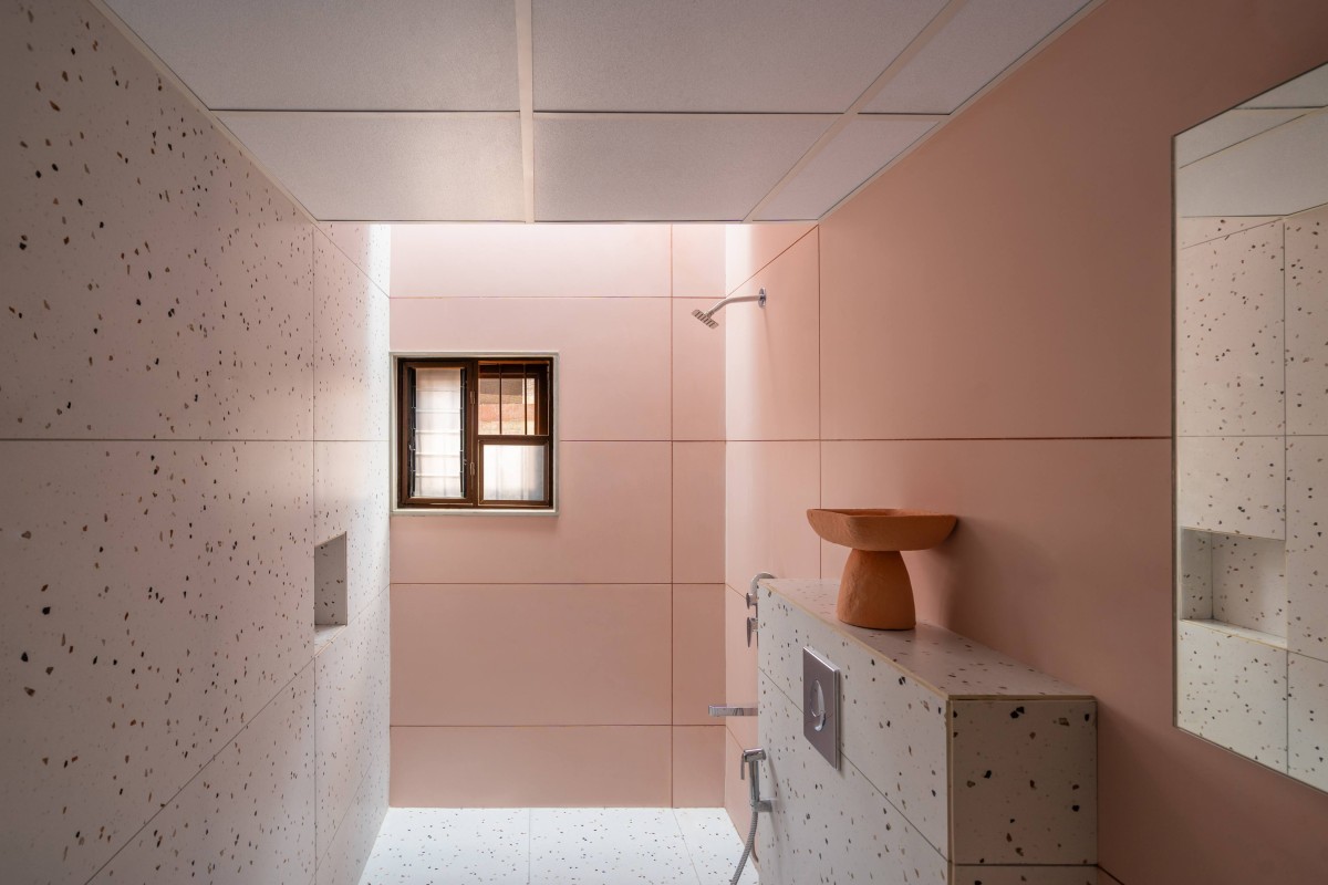 Toilet with a skylight of The Enfold by Studio Biosis