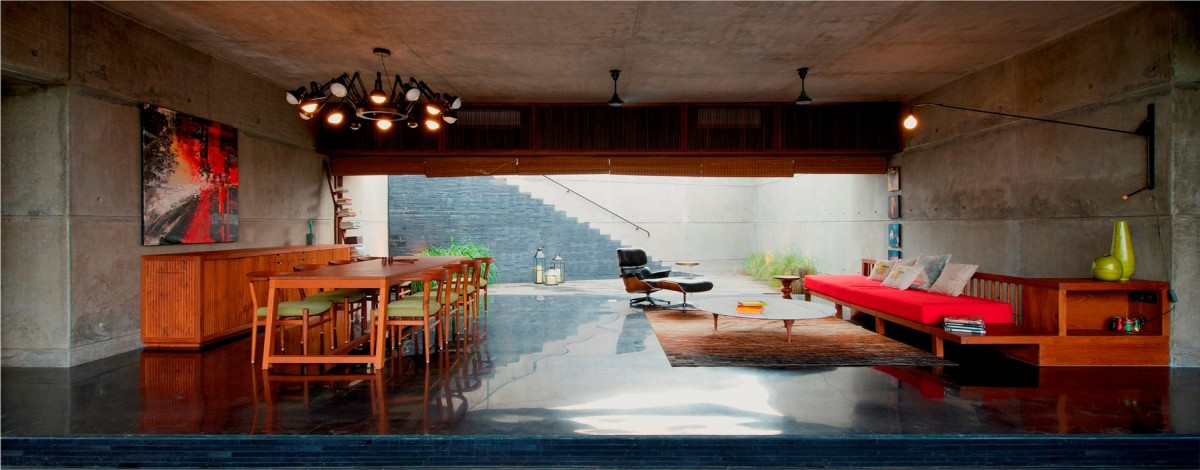 Living & Dining room of The House Cast in Liquid Stone by SPASM Design Architects