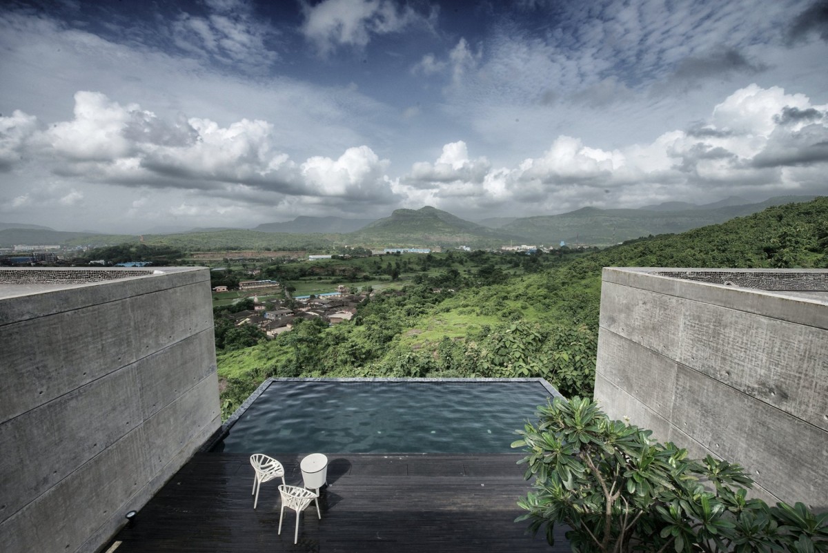 Pool view of The House Cast in Liquid Stone by SPASM Design Architects