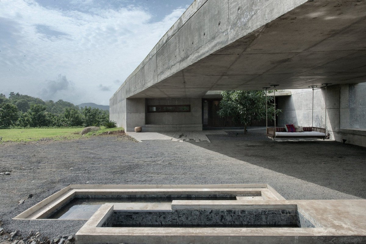 Exterior view of The House Cast in Liquid Stone by SPASM Design Architects