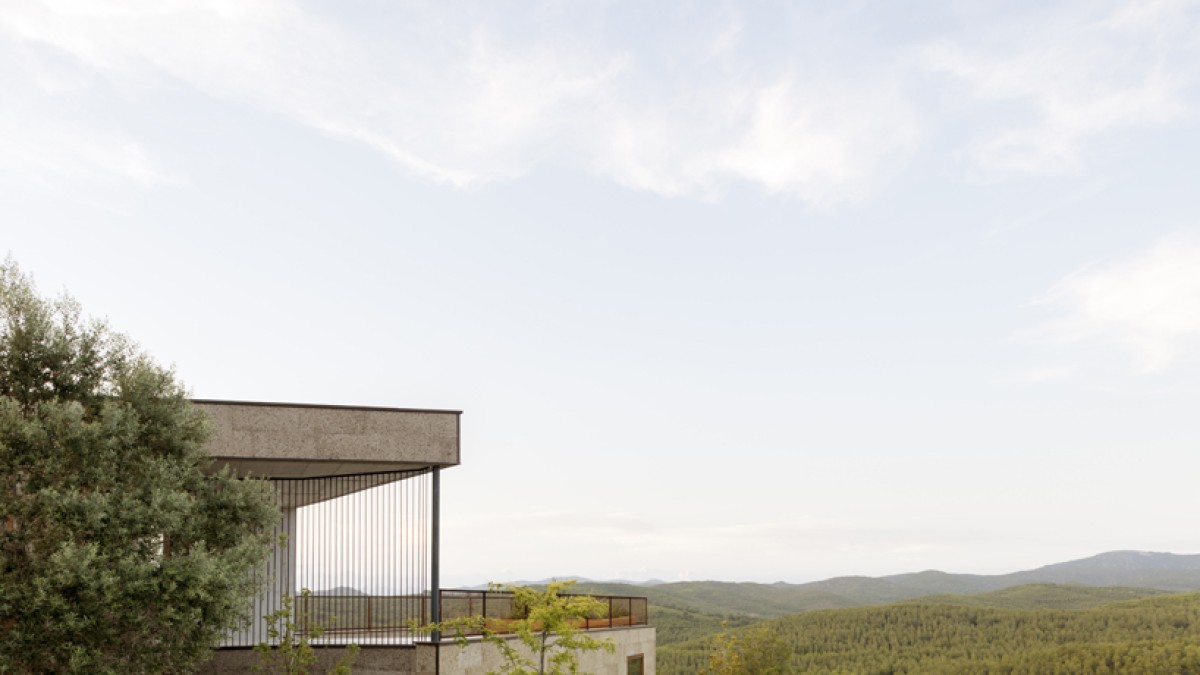 The architecture is designed to integrate into the topography of the site and the surrounding nature