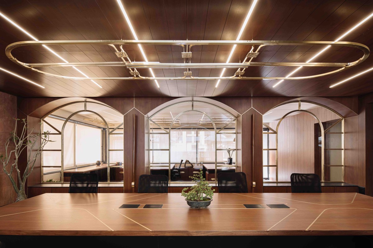 The identity of the Conference room is created by the arched openings as they stand out against a dark wooden background