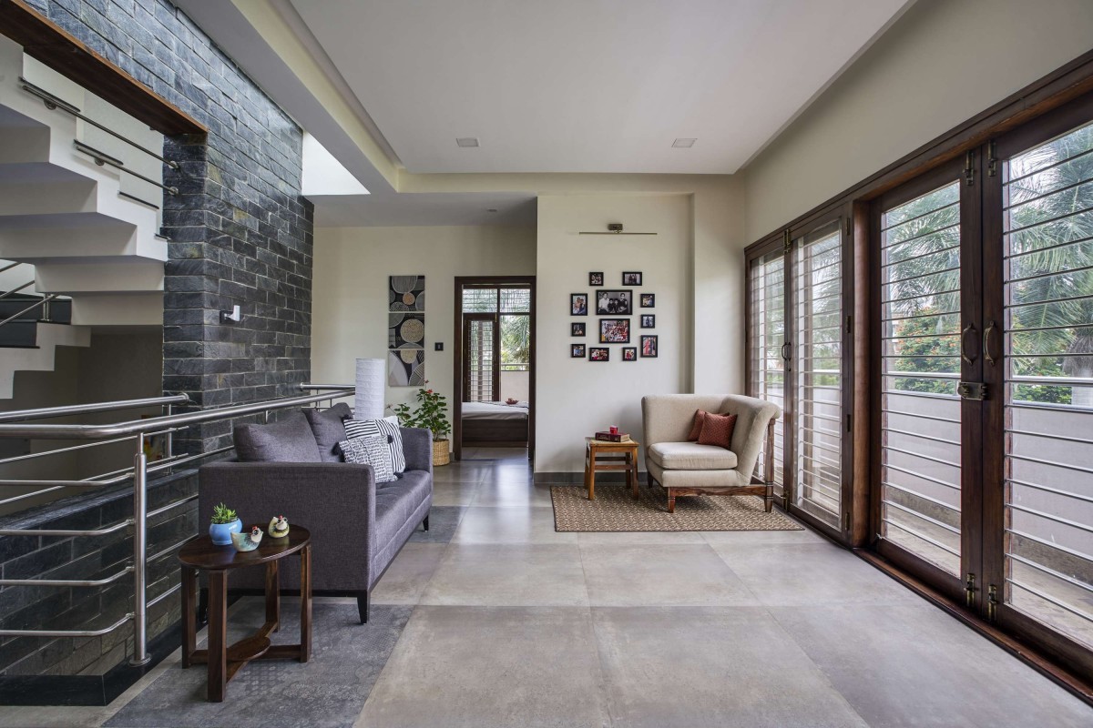 Family Living of Linear House by Int-Hab Architecture + Design Studio