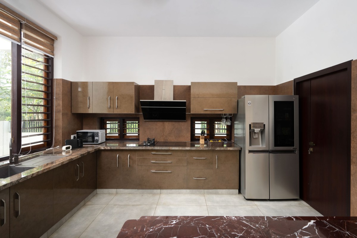 Kitchen of The Frangipani House by Designature Architects