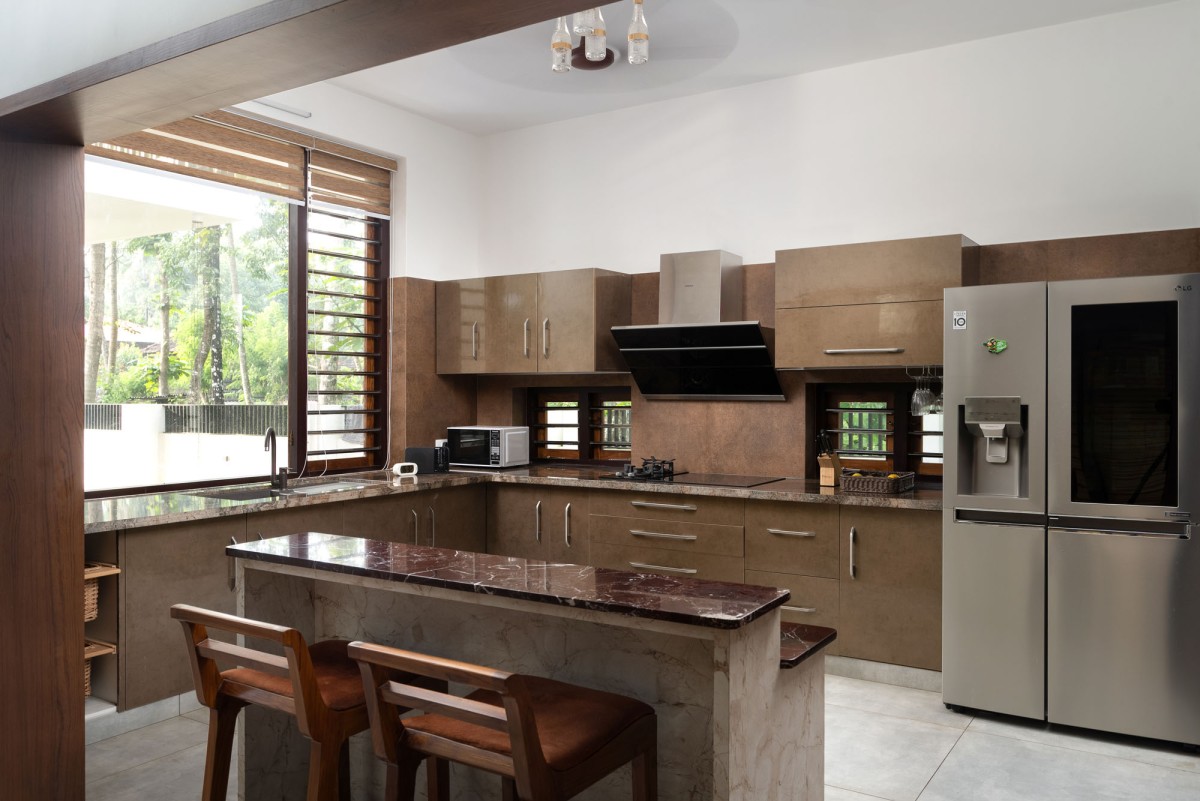 Kitchen of The Frangipani House by Designature Architects