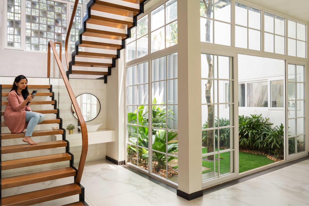 Staircase and courtyard of The Pravasi Home by Studio Vista Architects