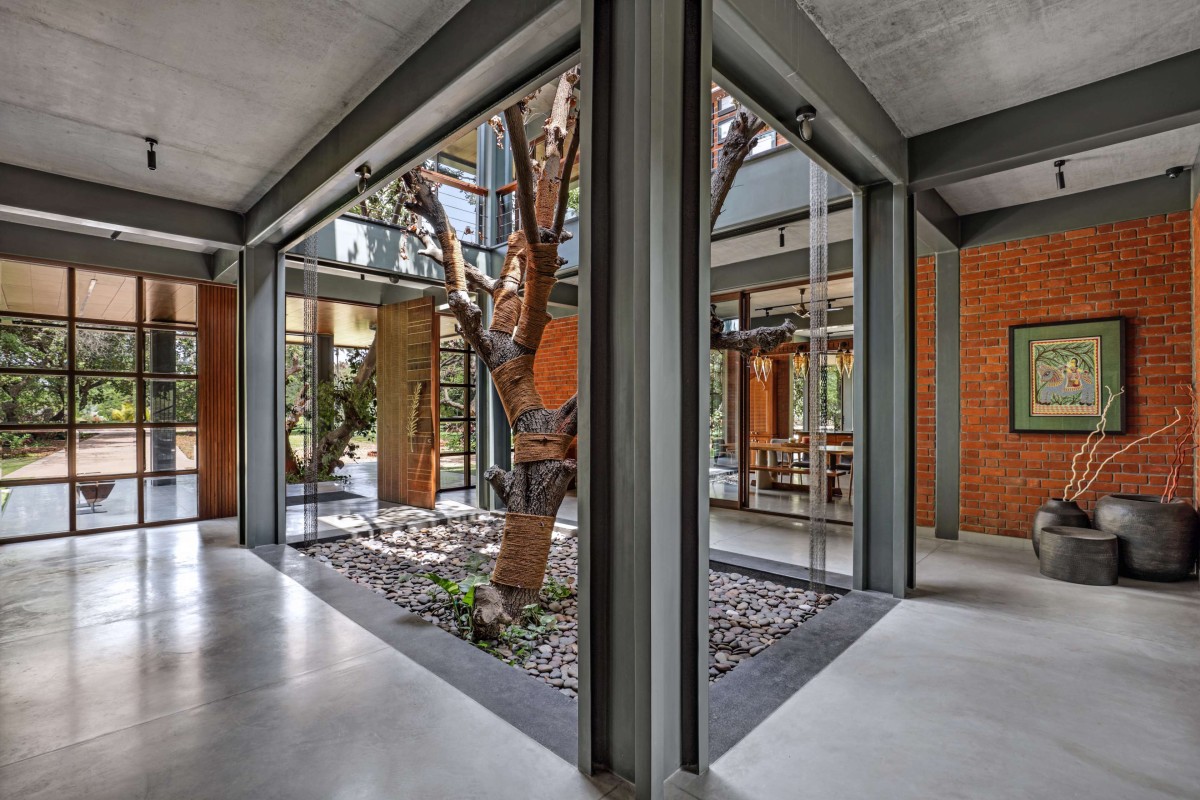 Ground Floor Courtyard of Nirmal Farmhouse by Dipen Gada & Associates